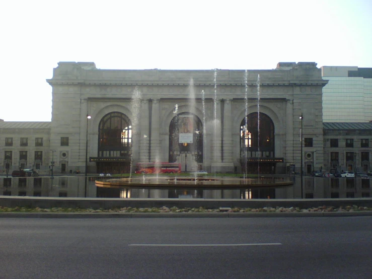 a large fountain sitting in front of a building