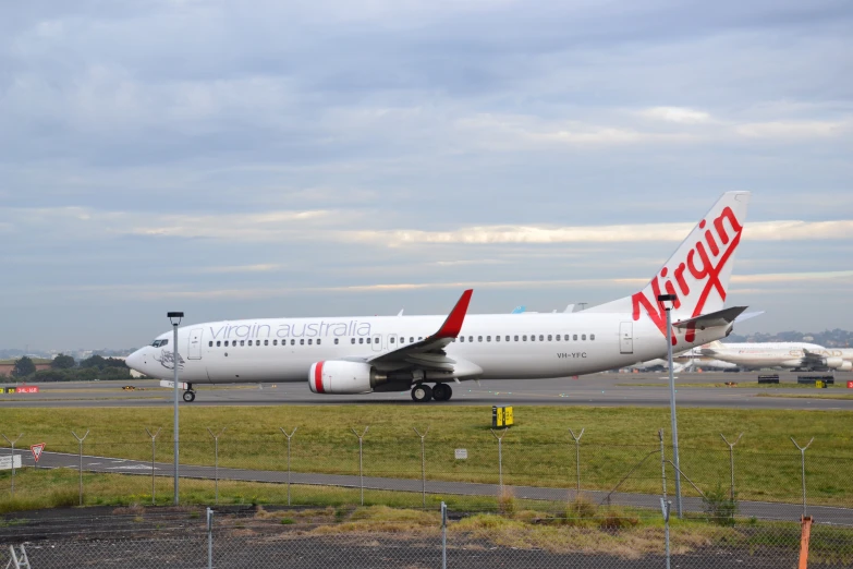 a large commercial jetliner sitting on top of an airport runway