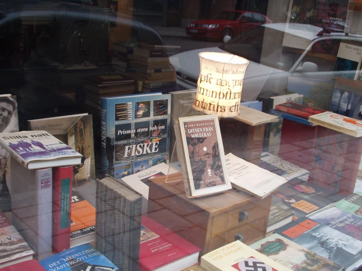 a display window filled with different books in a room