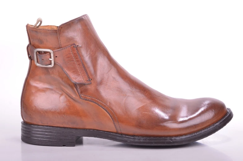 a close up of a brown ankle high boots