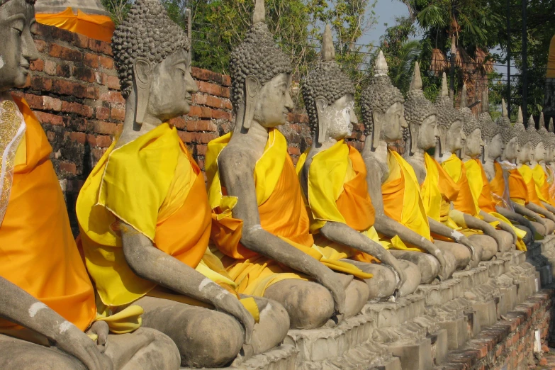 several buddhas are lined up in a row