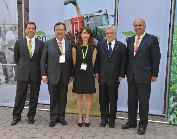 a group of business people standing around each other