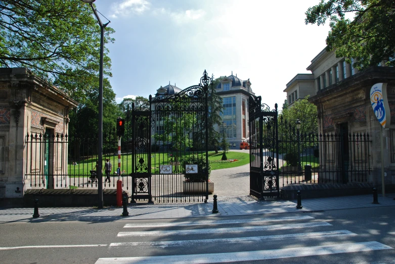 a street is paved in front of a gate