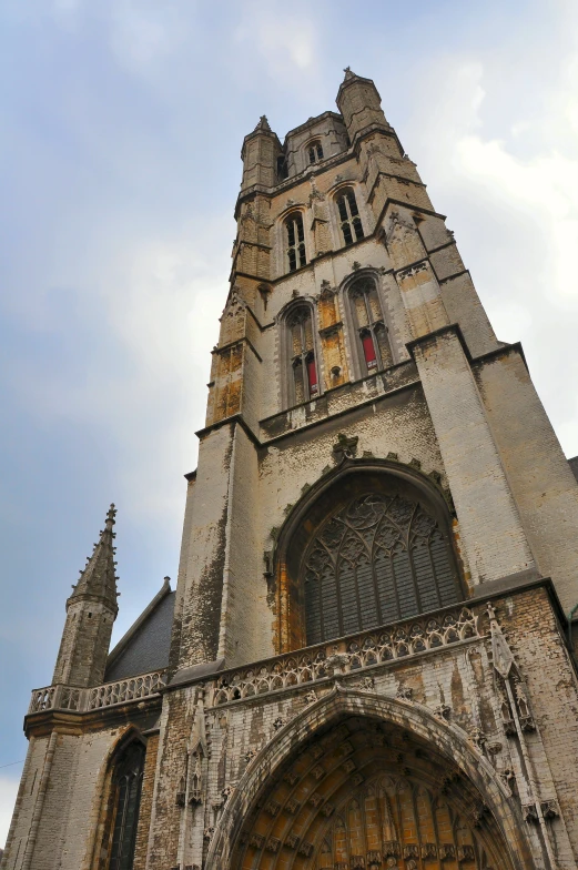 an old, large cathedral with a clock on the front