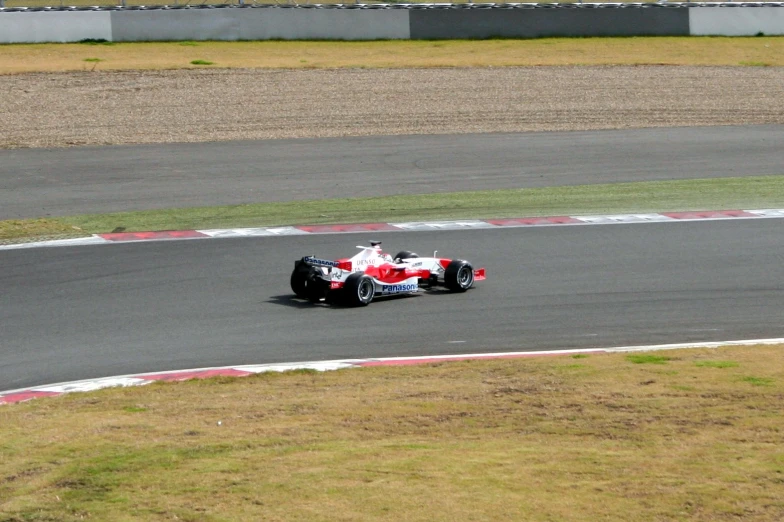 the formula racing car takes off on a sharp hill