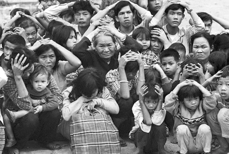 a crowd of young people standing around each other