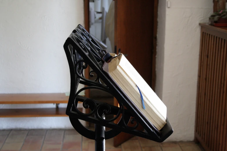 a close up of a bench with a book on top