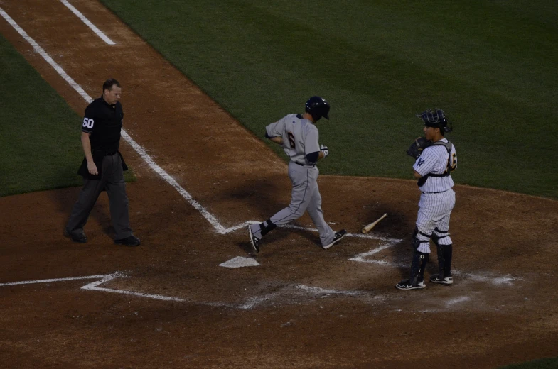 a baseball player is holding a bat during a game