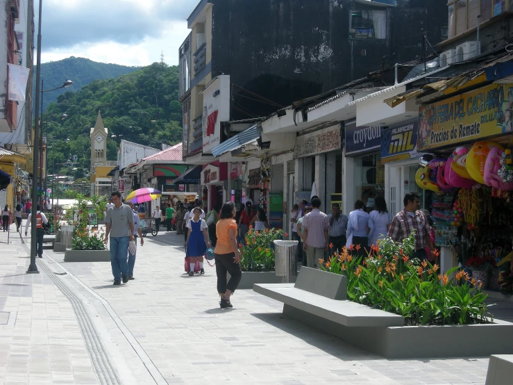 a busy shopping area with many people in it