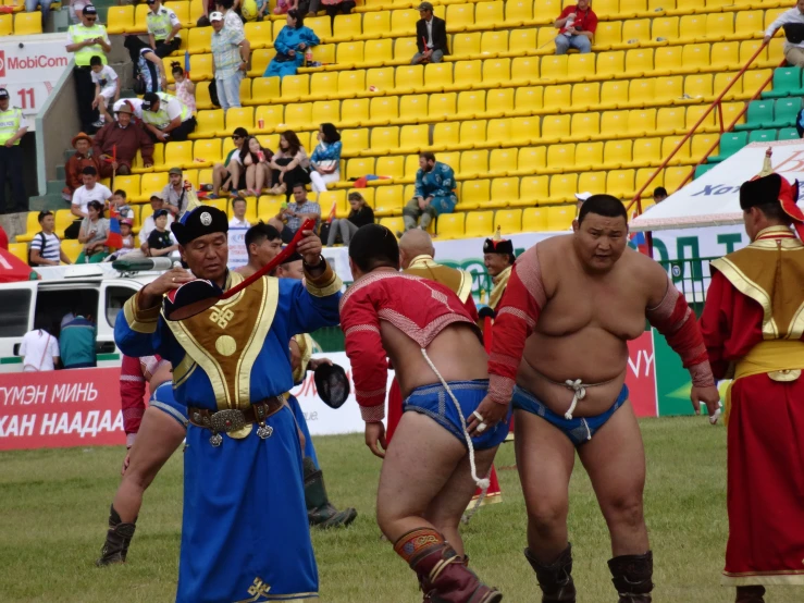 two sumo wrestlers with no underwear at a sumo competition