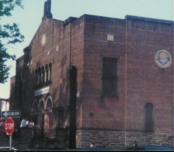 a large brick building sitting on top of a street