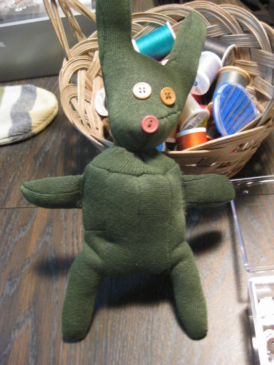 a close up of a stuffed animal on a wooden table