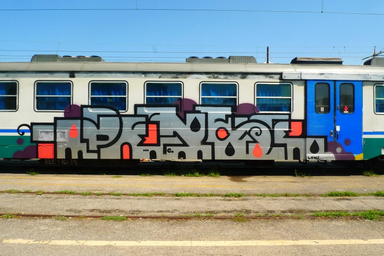 the train is painted many different colors and styles