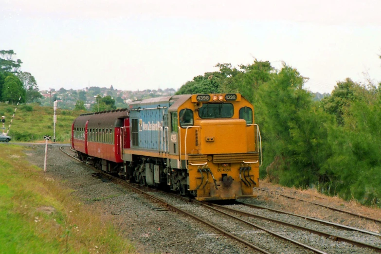 an old train traveling through the country side