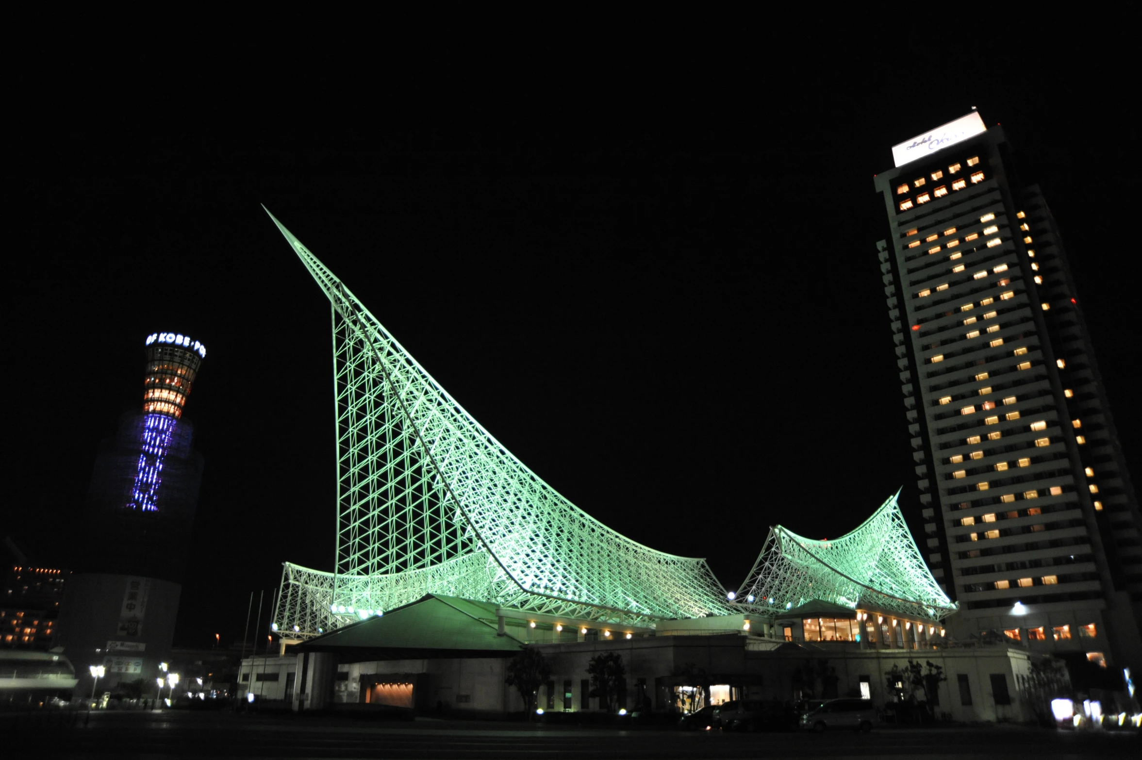 illuminated architecture against a dark sky in a city