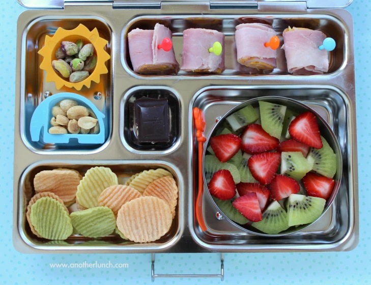 a compartmented tray containing a number of compartments holding various foods