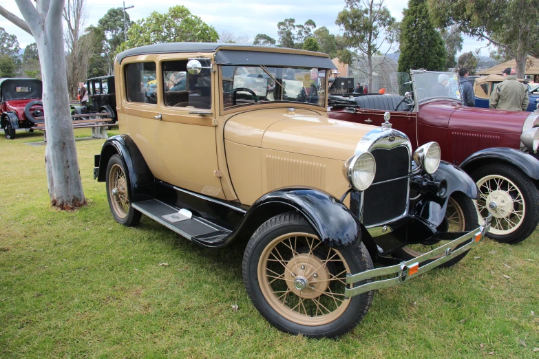 an antique car is parked at a car show