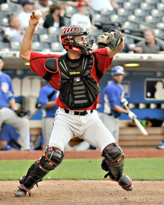 baseball player pitching the ball during a game