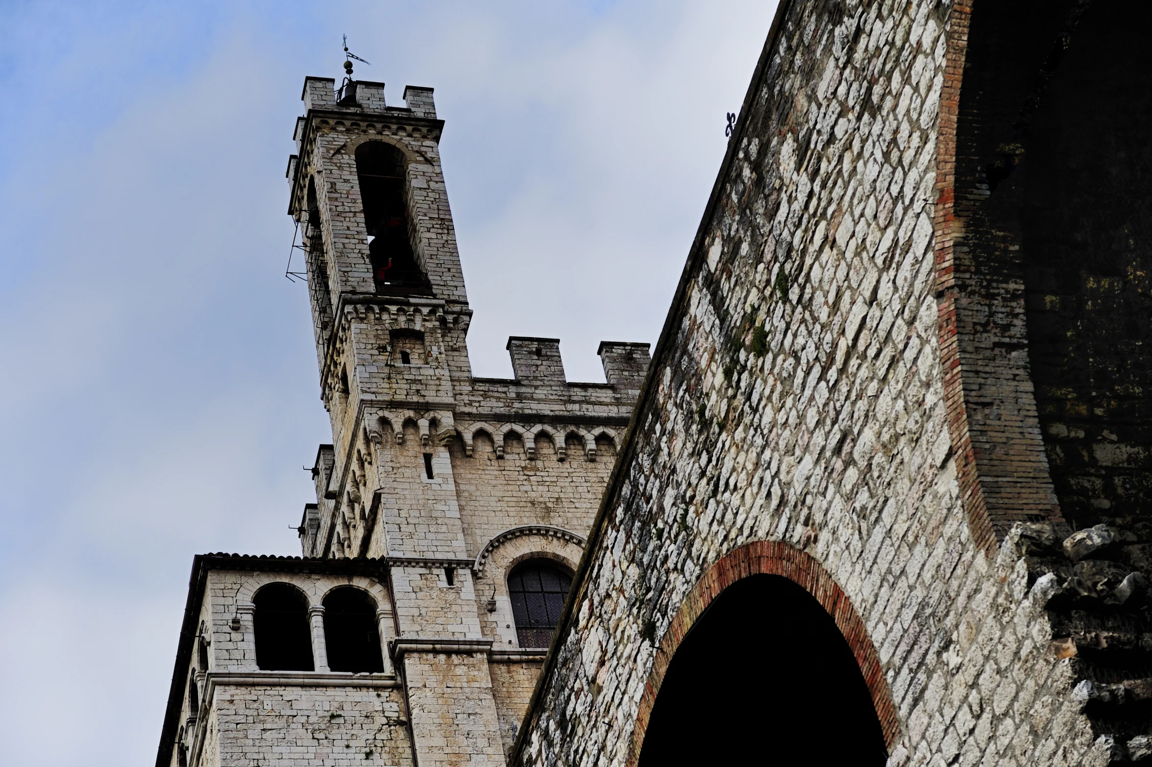 a tall clock tower sitting above two other towers