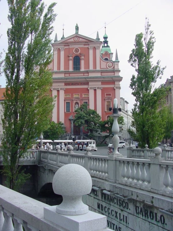 a bridge over a river with cars on the side