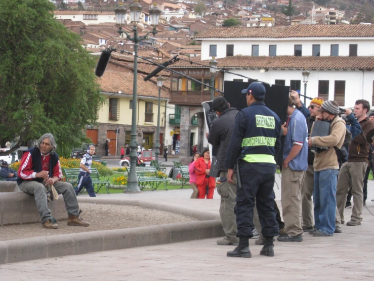 a group of people standing and sitting on steps