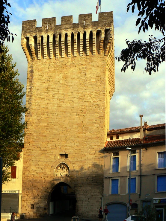 a large brick tower has a doorway in it