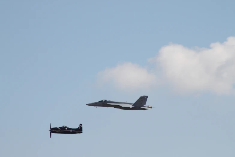 two old air planes flying in opposite directions