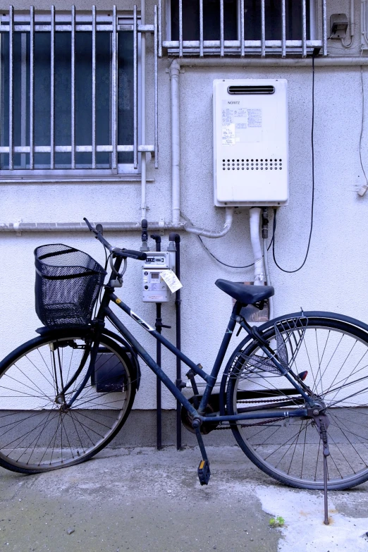 the bicycle has a back basket by the phone