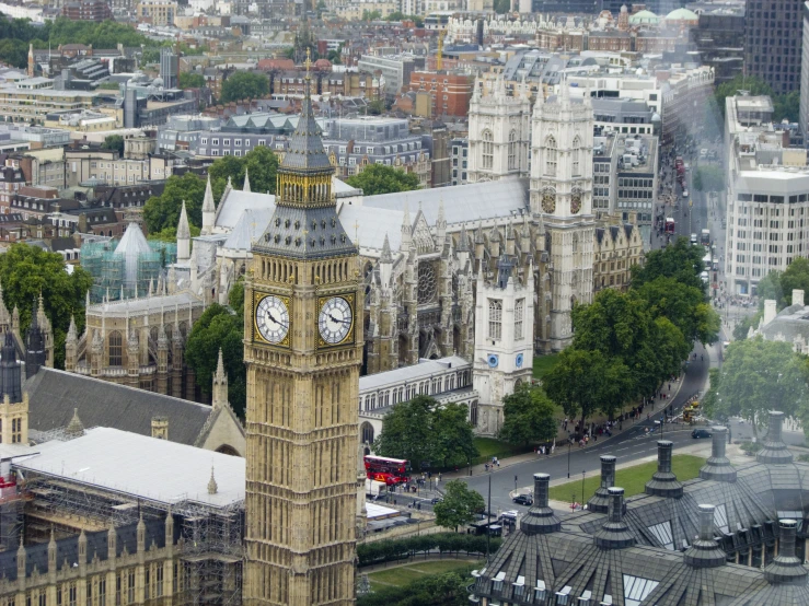 a large clock tower rises above the city