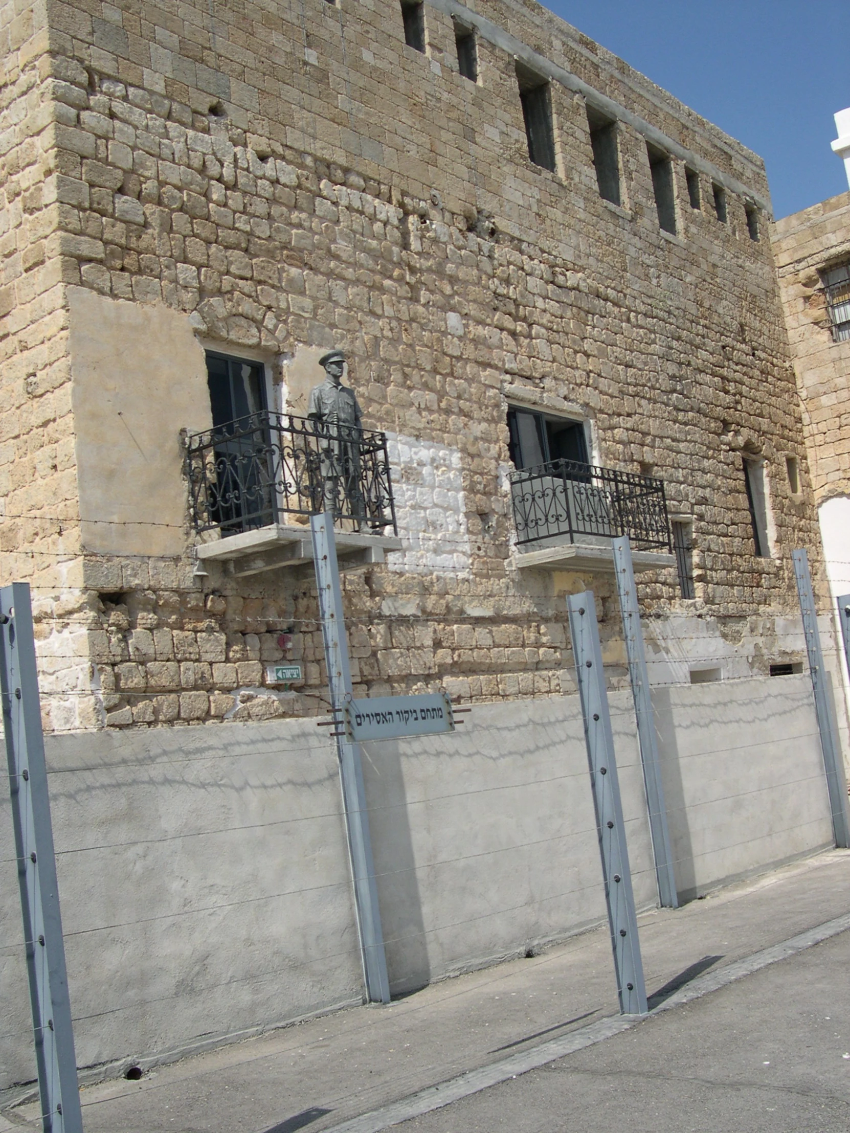 the fence is separating an area outside the building