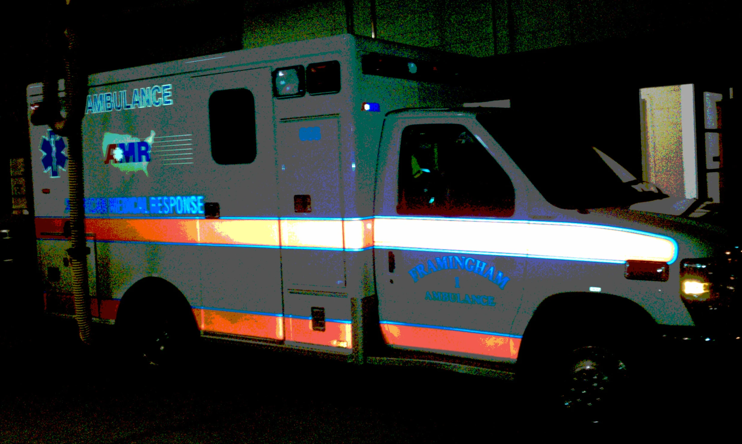 an ambulance at night with its doors closed