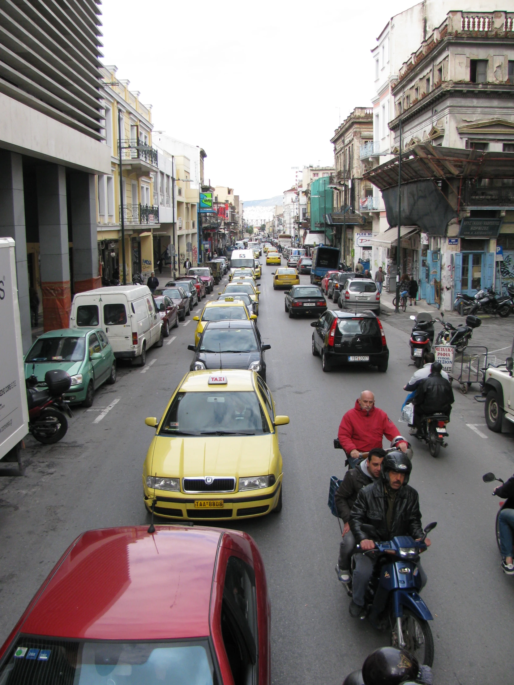 a number of people on motorcycles in a street