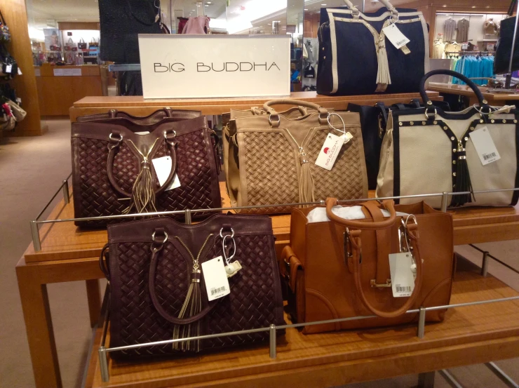 a display of purses and handbags inside a store