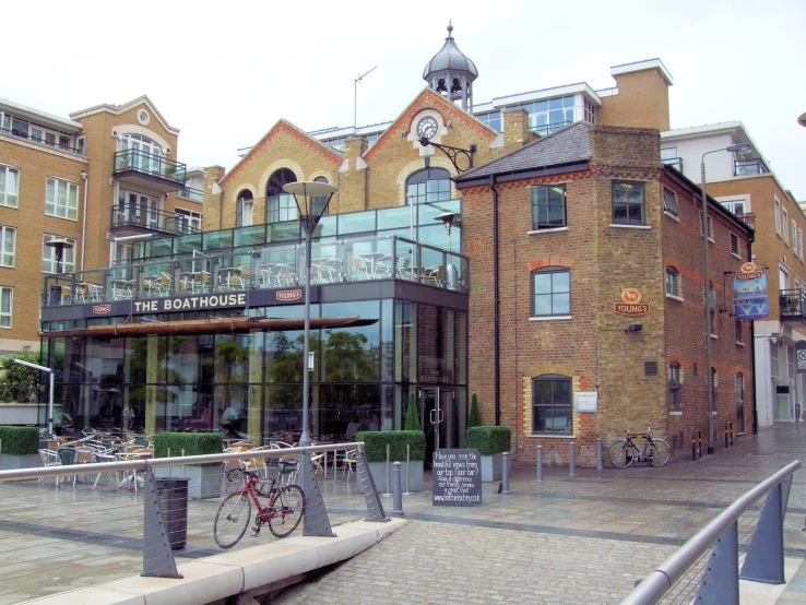 the front entrance to the building with some bikes in it