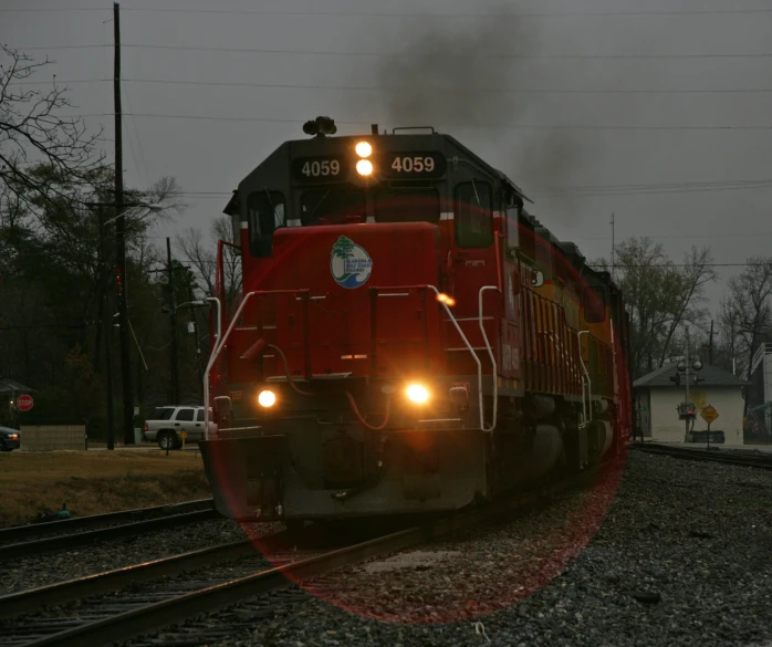 a train moving down the tracks at night