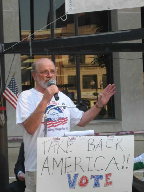 an older man making a funny face on the stage