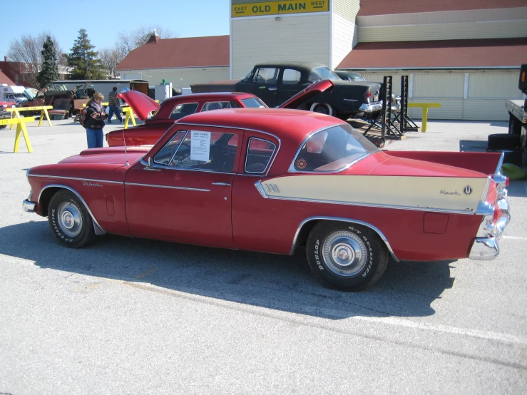 a car sits in the parking lot of an old town