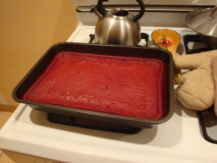 the homemade red sauce is in a pan on top of a stove