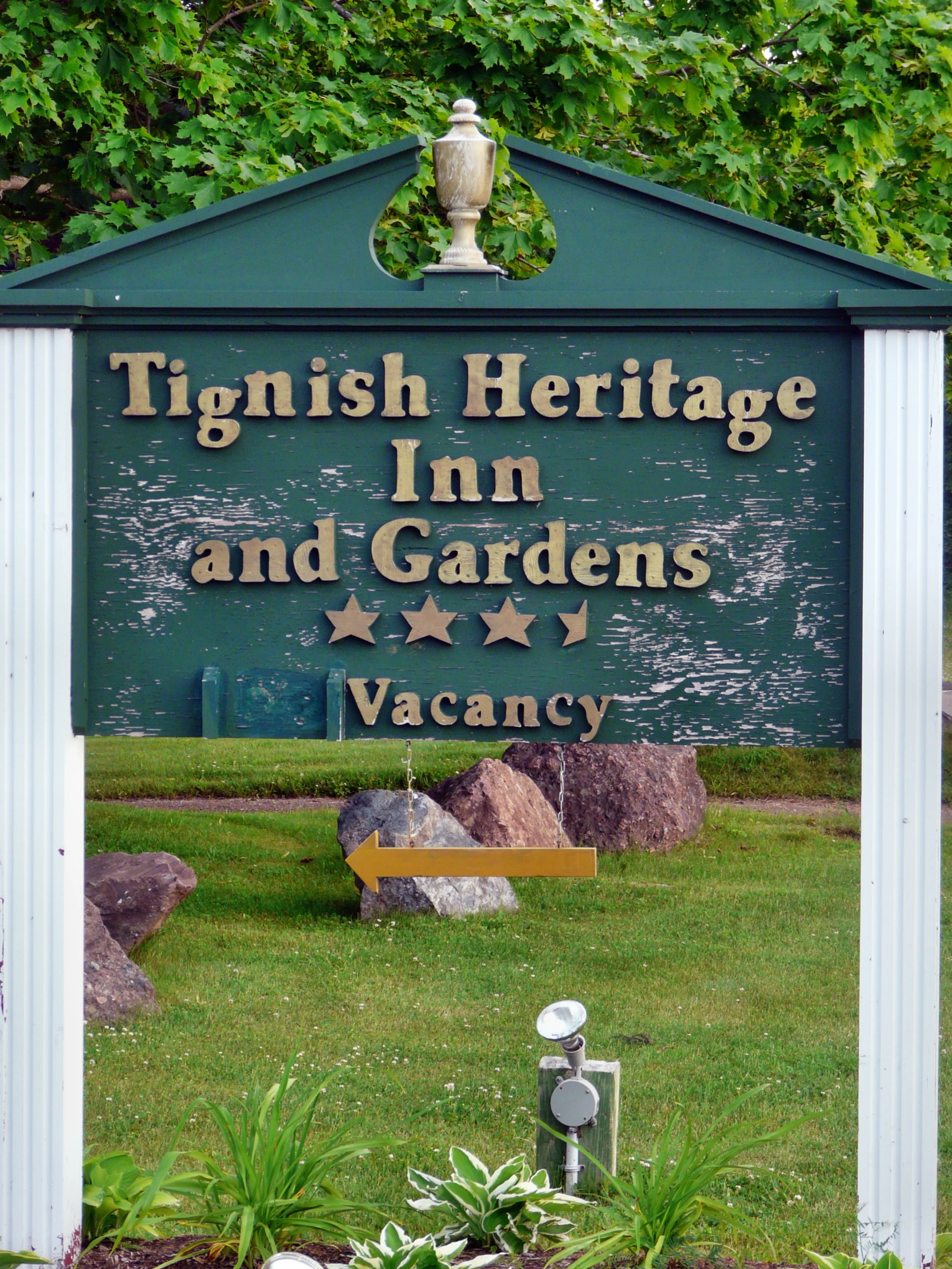 a sign at the entrance to the garden nursery