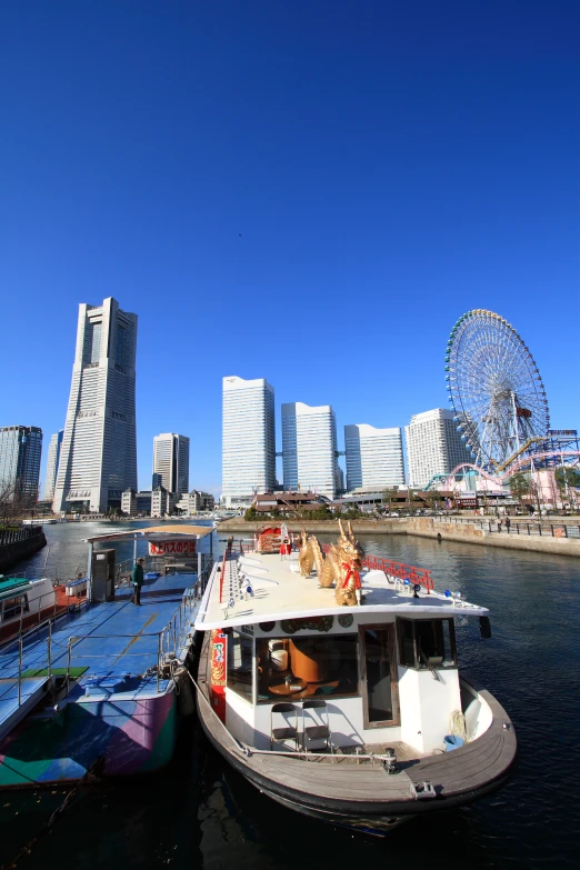 a ferry on the water near many different buildings