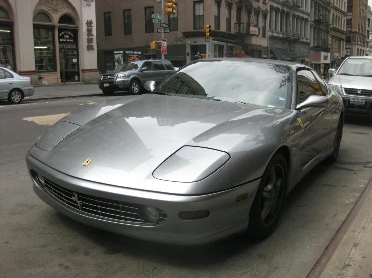 a silver car parked on the side of a road