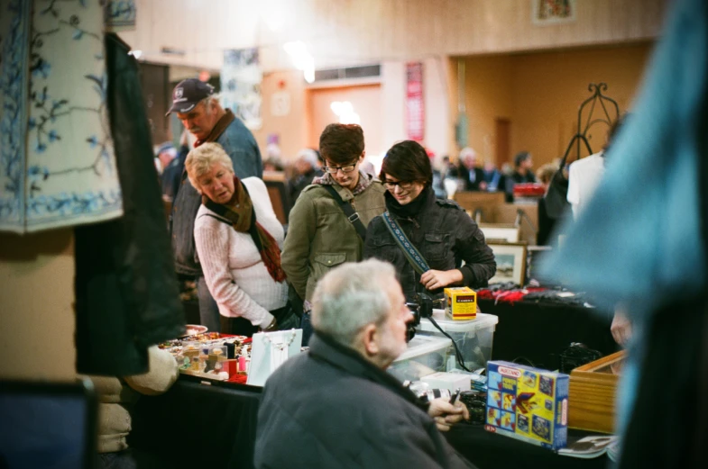 a group of people at a flea market