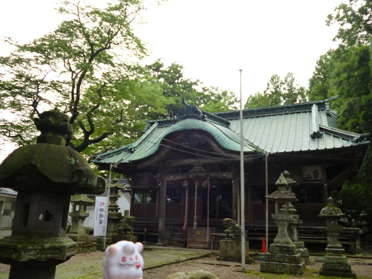 a japanese temple and shrine near trees