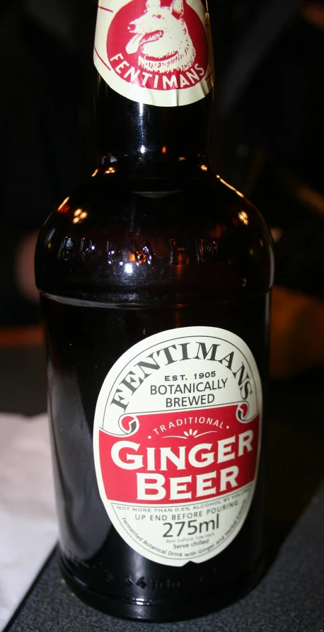 a bottle of beer sitting on top of a table