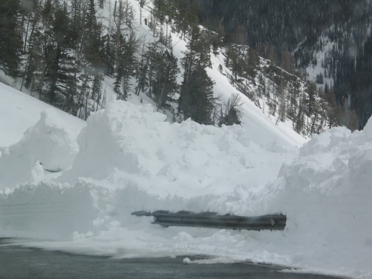 a ski slope and snow piles in the snow