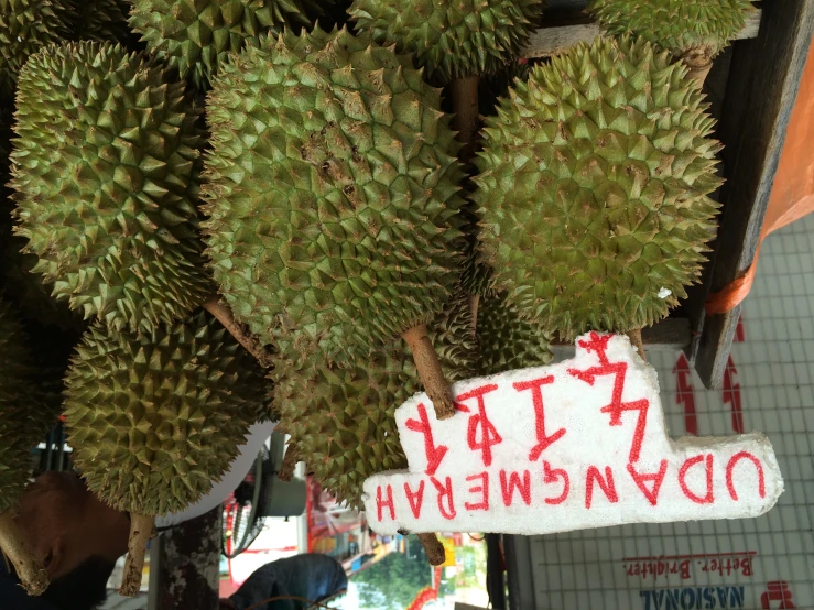 a display of various fruit on a market stand