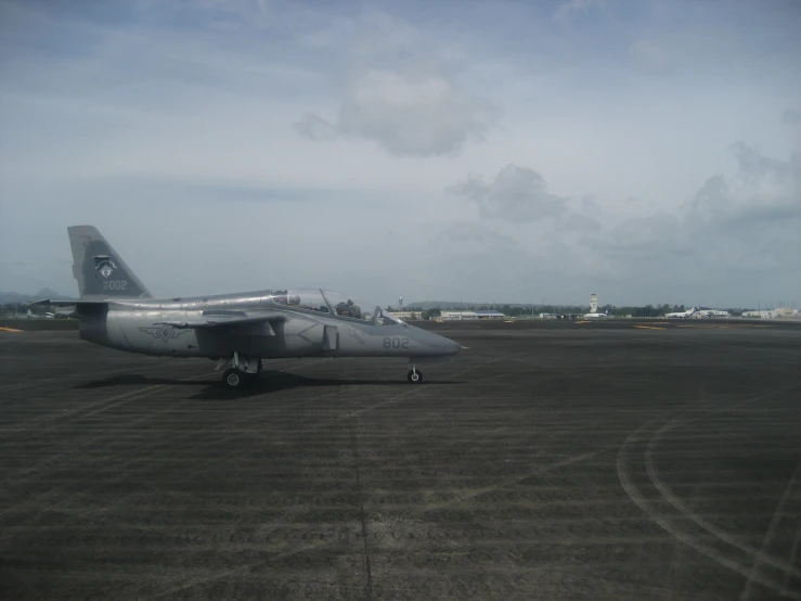 an old aircraft sitting on an airport tarmac