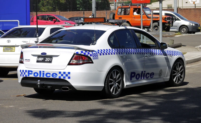 a police car is parked in a parking lot