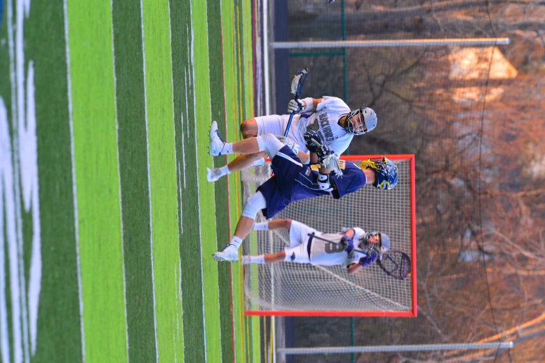 a lacrosse player runs through the air with the ball