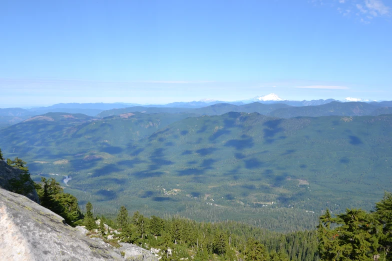 a scenic view with a few mountains in the distance